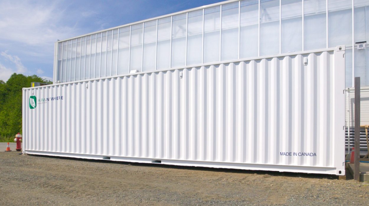 Container farm in front of greenshouse