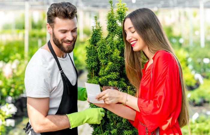 Plant seller with buyer in the shop